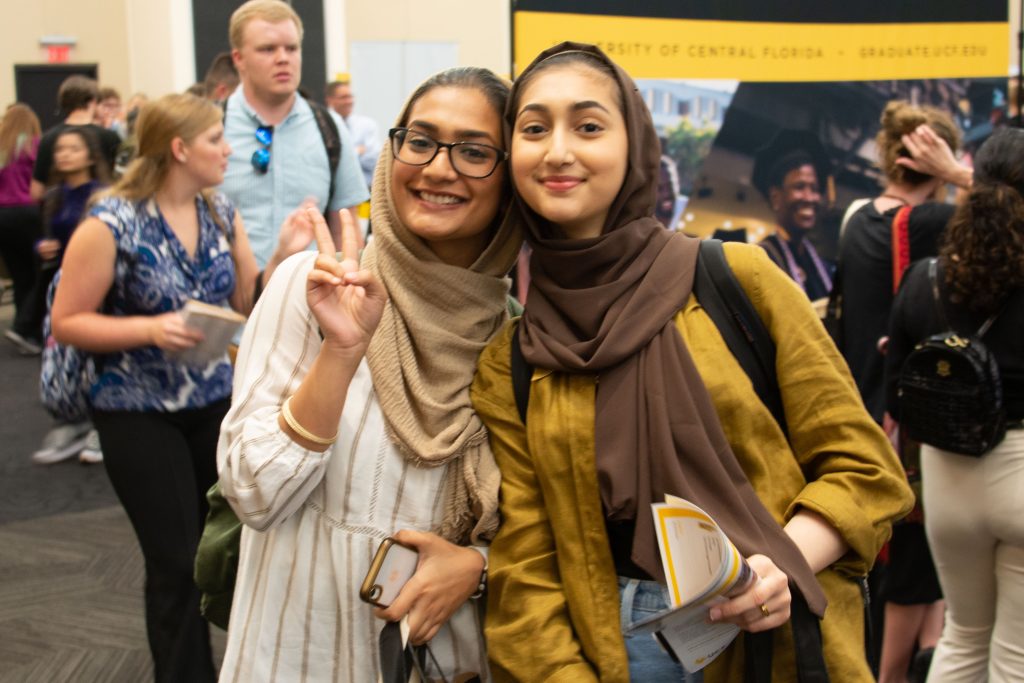 Two friends enjoying Grad Fair