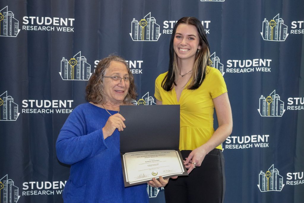 Elizabeth Klonoff (Dean) and Sydney Snowden (master's winner)