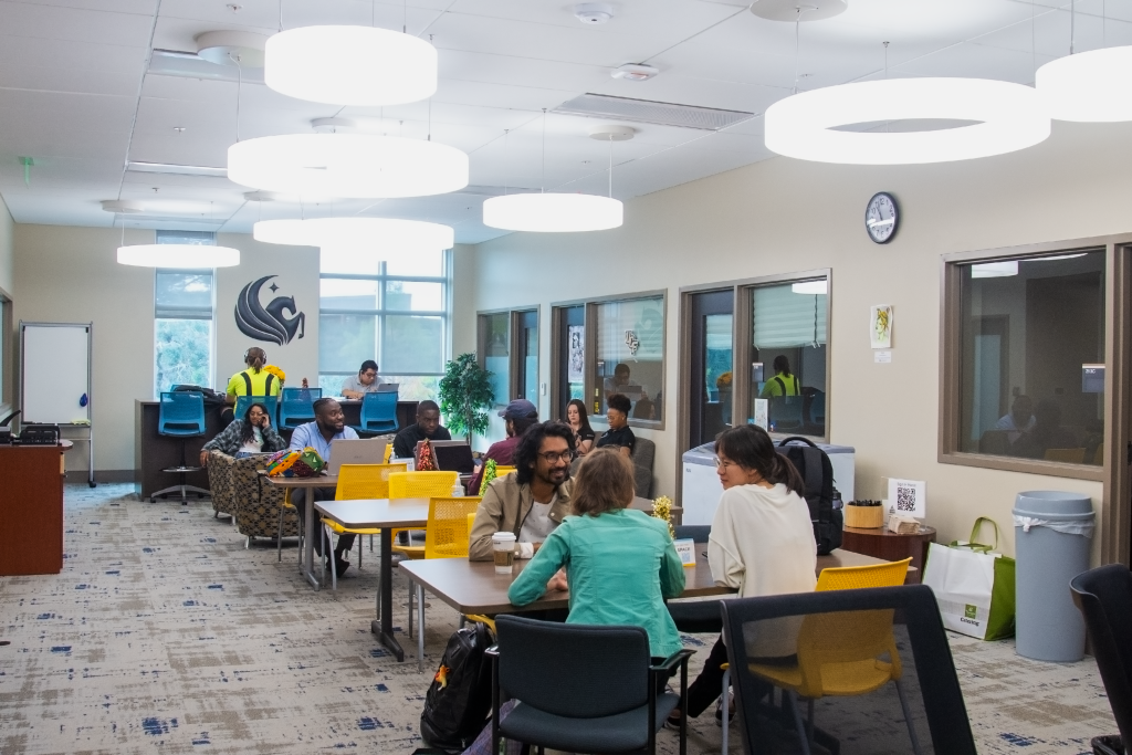 Students smiling in the Graduate Student Center