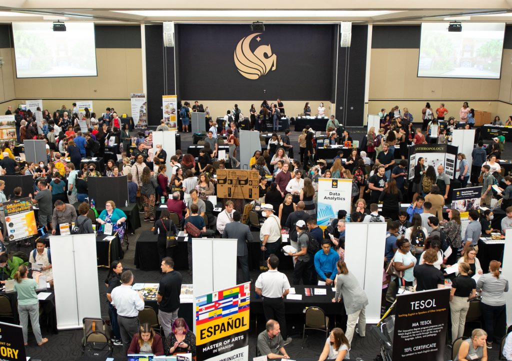 Students, faculty, and staff in the Pegasus Ballroom for Grad Fair