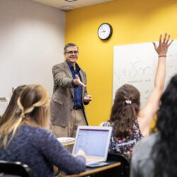 Lecturer speaking to a group of people