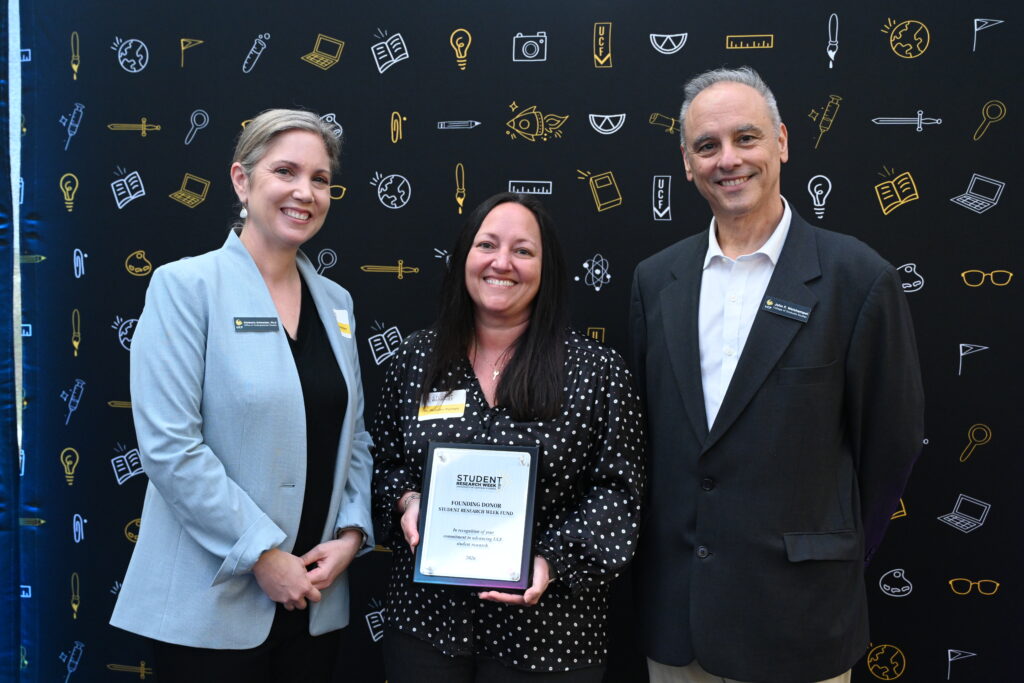 Kim Scheider, Jennifer Parham, John Weishampel recognition for a founding donors gift for Student Research Week.