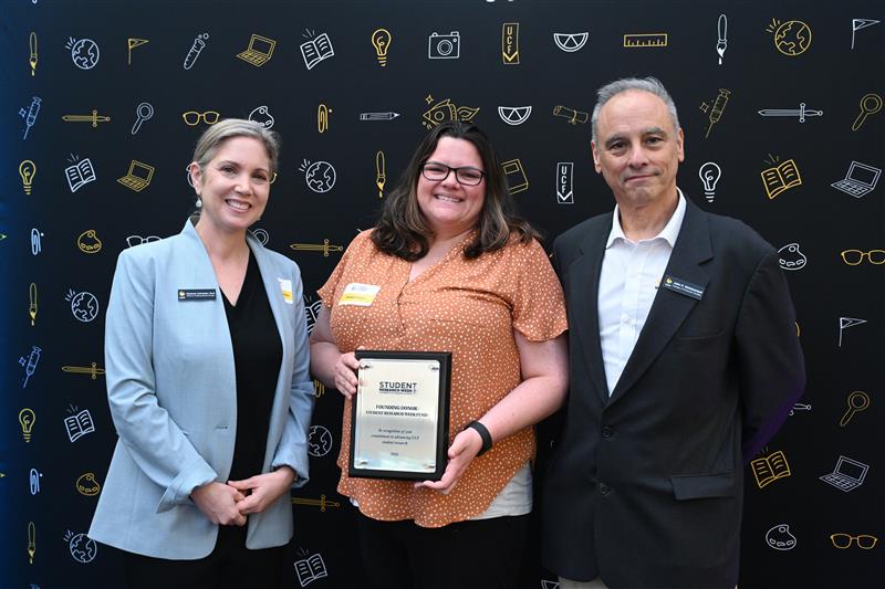 Kim Schneider, Tamara Gabrus and John Weishampel recognition for a founding donors gift for Student Research Week.