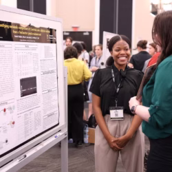 Student presenting their poster at Student Research Week