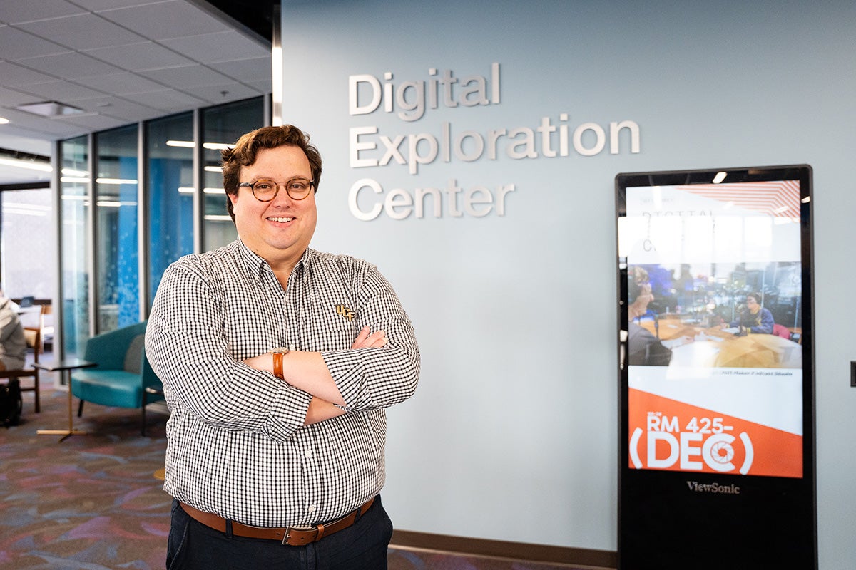 Eric Thompson ’19, a history alum pursuing a doctorate in texts and technology, enjoys bringing history to life beyond the classroom, in places like museums, parks monuments and the UCF Libraries’ Immersion Studio. (Photo by Brooke Morris ’22)